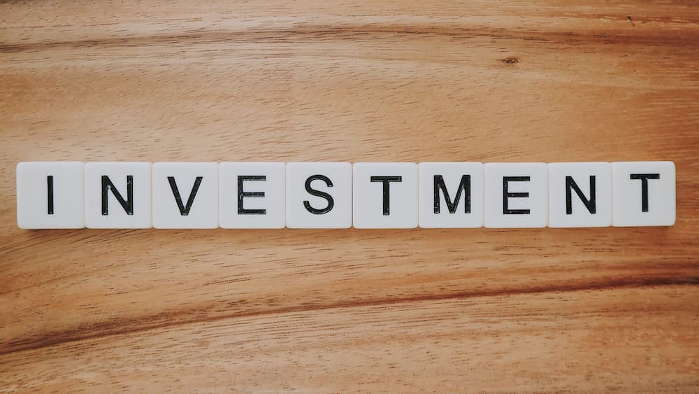 Tiles spelling out the word investment